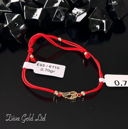 Red thread bracelet with 585 gold details. 0.70gram