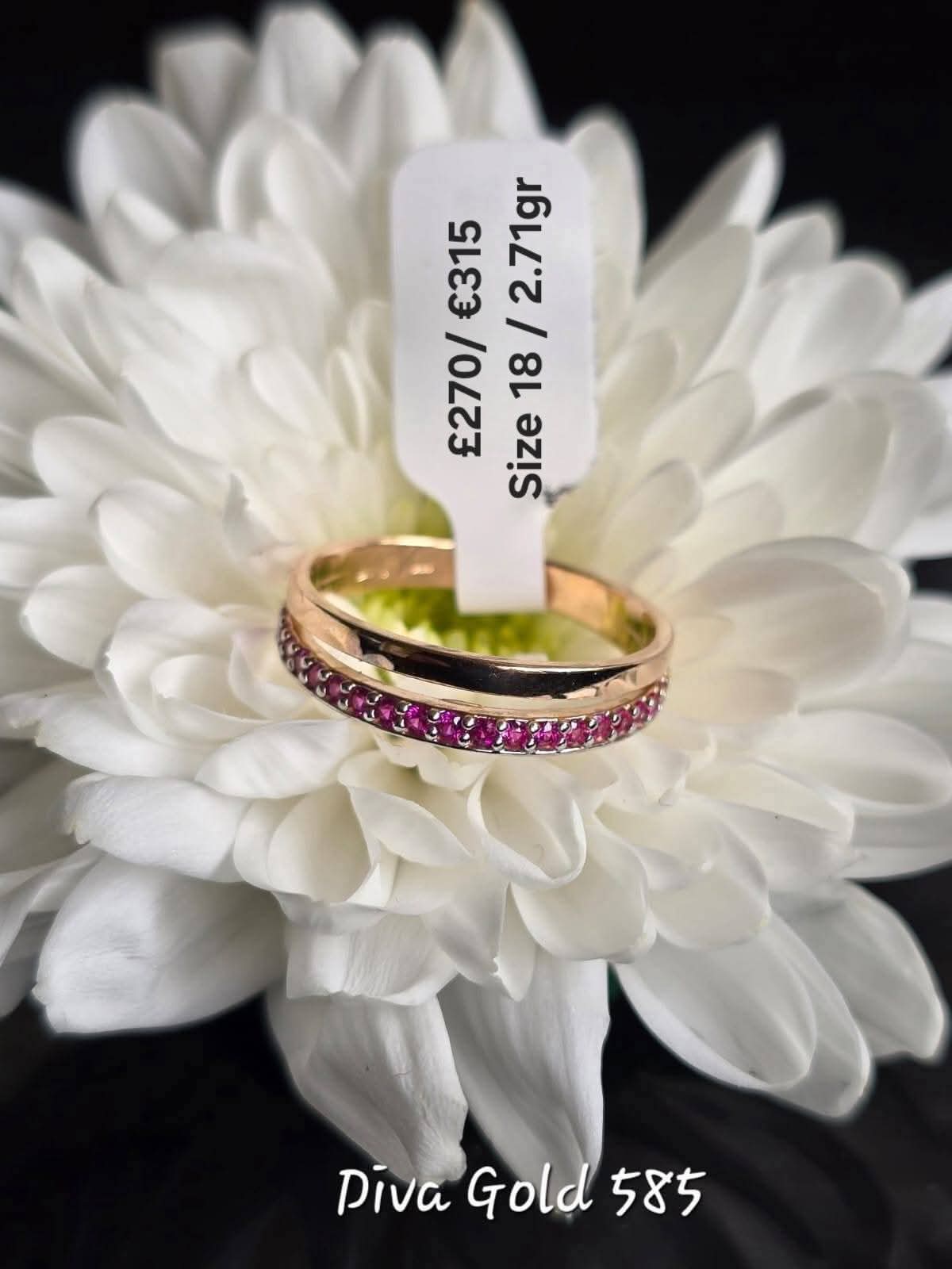 Gold ring with pink zircon stones. Size 18