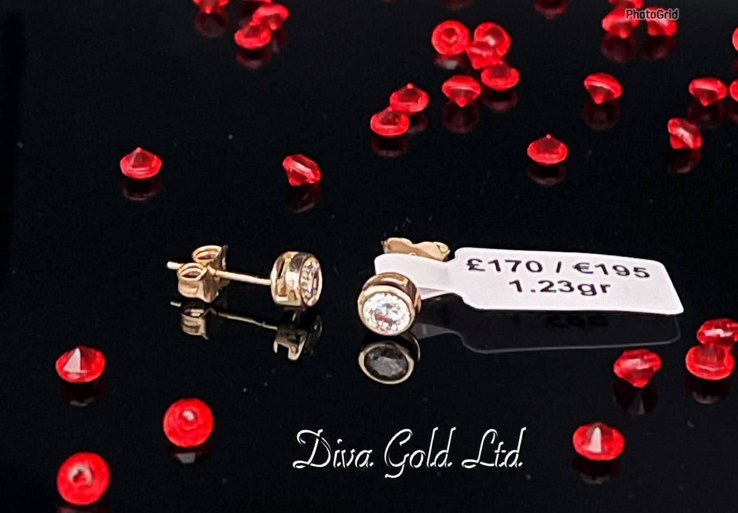 Stud gold earrings. White zircon stones