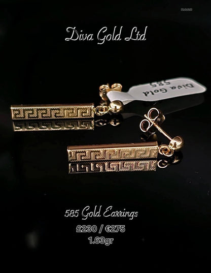 Stud gold earrings.